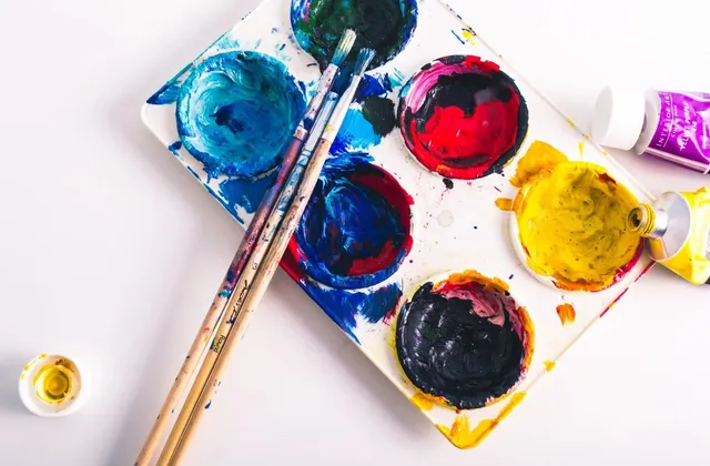 A watercolor palette and brushes