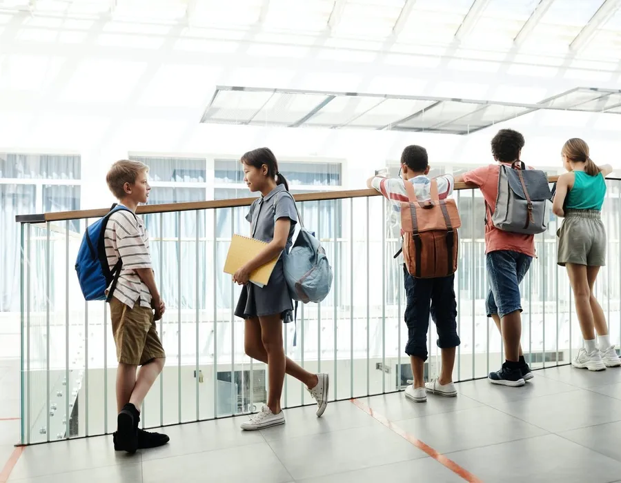 A group of teens talking together outdoors