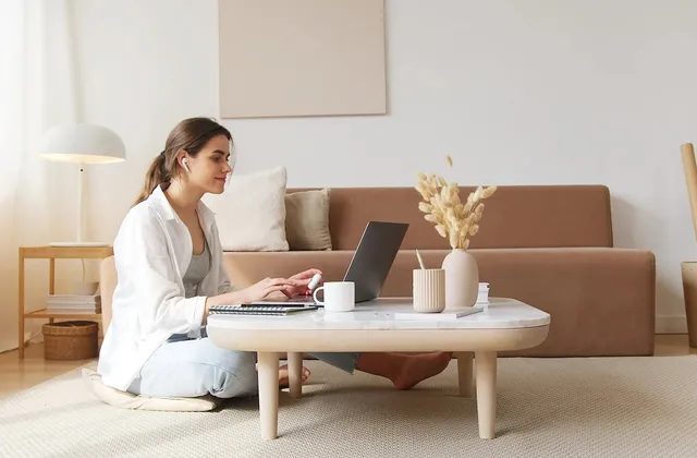 A therapist on a video session from a bright, calm office