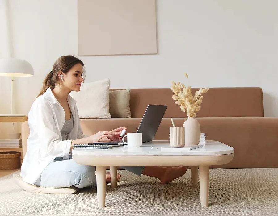 A therapist on a video session from a bright, calm office